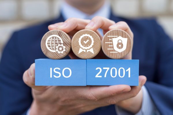 Man,Holding,Blocks,With,Icons,Sees,Text:,Iso,27001.,Iso Man,Holding,Blocks,With,Icons,Sees,Text:,Iso,27001.,Iso