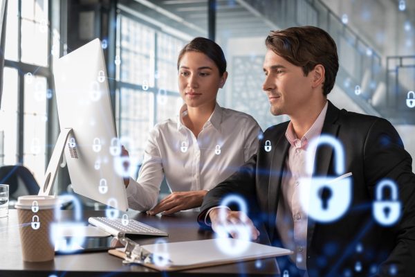 Businessman,And,Businesswoman,Working,Together,To,Protect,Clients,Confidential,Information Businessman,And,Businesswoman,Working,Together,To,Protect,Clients,Confidential,Information