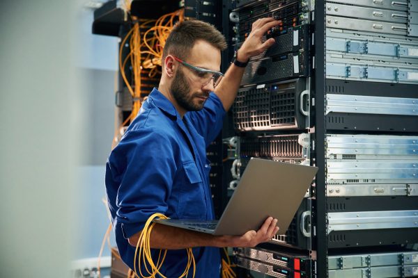 Using,The,Laptop.,Young,Man,Is,Working,With,Internet,Equipment
