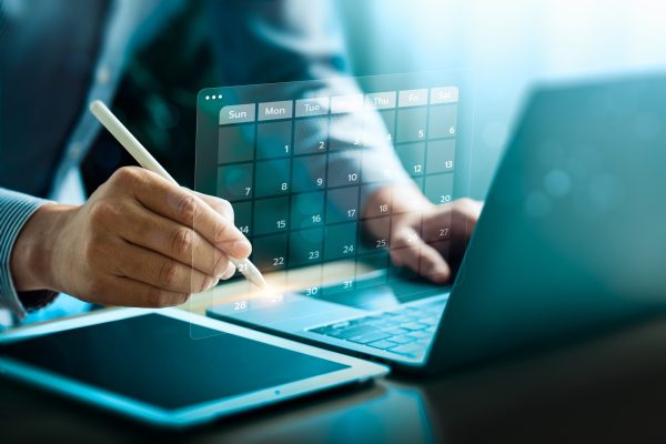 Business,Professional,Using,Digital,Tools,To,Manage,A,Futuristic,Calendar