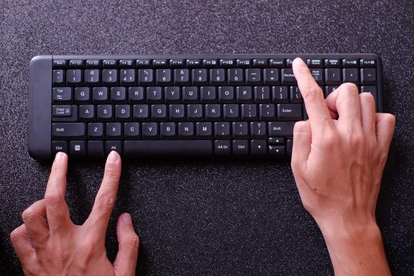 Hands,Pressing,Ctrl,Alt,Del,On,Computer,Keyboard,,With,Black Hands,Pressing,Ctrl,Alt,Del,On,Computer,Keyboard,,With,Black