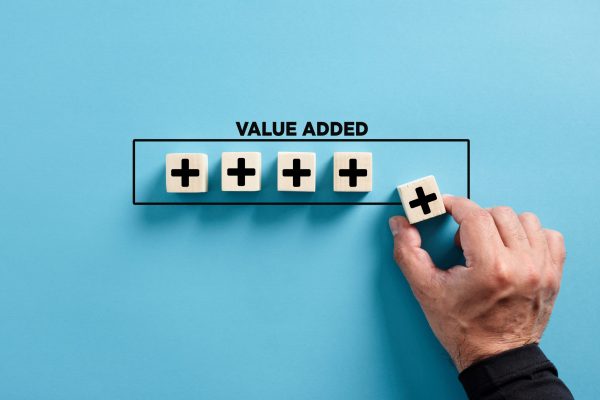 Male,Hand,Puts,The,Wooden,Cube,With,Plus,Icon,With