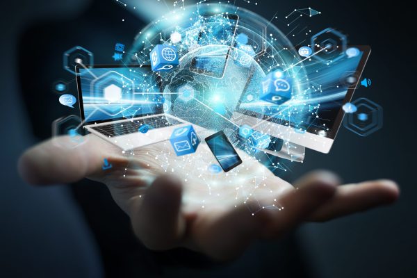 Tech,Devices,Connected,To,Each,Other,By,Businessman,On,Blurred