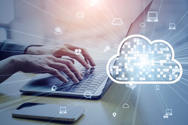 Cloud,Computing,Concept,With,Business,People,Using,Laptops,In,Office