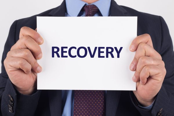Man,Showing,Paper,With,Recovery,Text