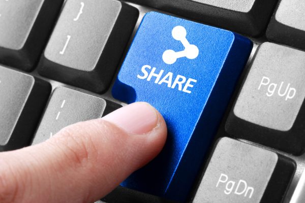 Sharing,File.,Gesture,Of,Finger,Pressing,Share,Button,On,A
