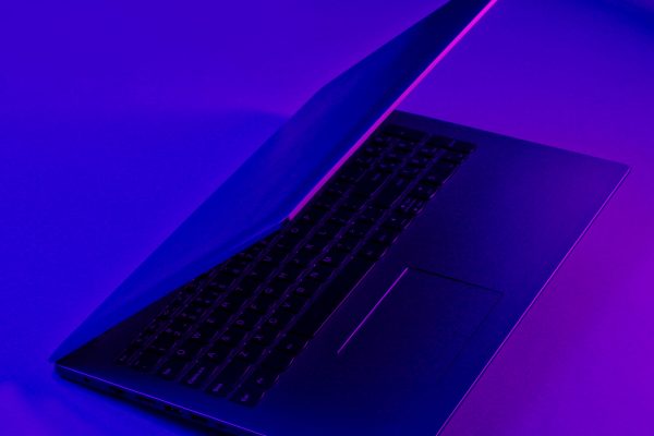 Modern,Laptop,With,Vibrant,Gradient,Violet,Blue,Neon,Color,Lights.