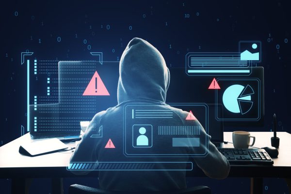 A,Hacker,With,A,Hood,In,Front,Of,A,Computer,