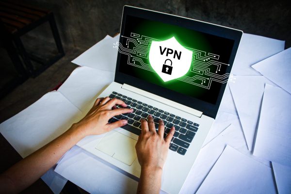 A,Person,Using,A,Laptop,With,A,Vpn,Security,Shield