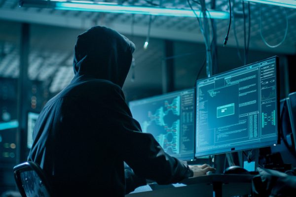 Shot,From,The,Back,To,Hooded,Hacker,Breaking,Into,Corporate Shot,From,The,Back,To,Hooded,Hacker,Breaking,Into,Corporate